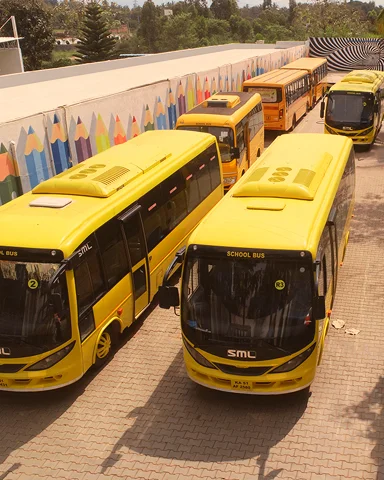 Triumph World School, Electronic City, Bangalore - CCTV & GPS-Enabled School Buses Parked on Campus