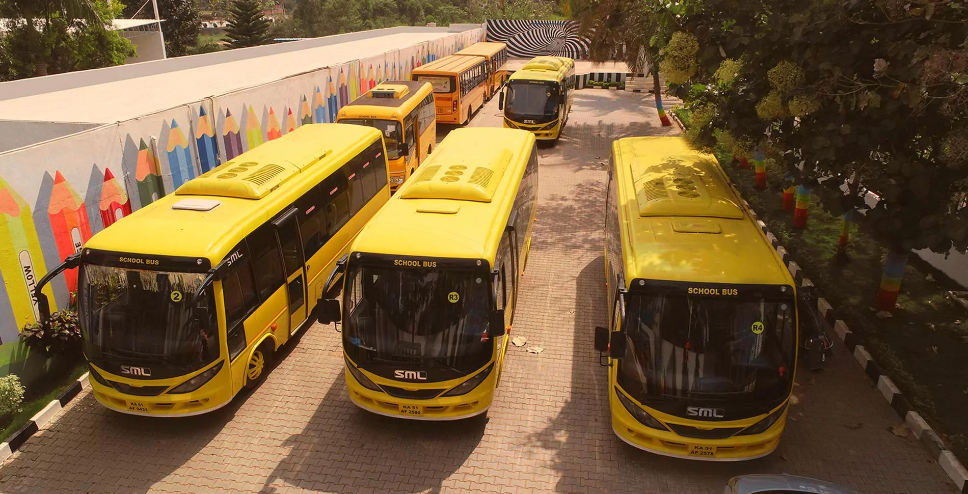 Triumph World School, Electronic City, Bangalore - CCTV & GPS-Enabled School Buses Parked on Campus